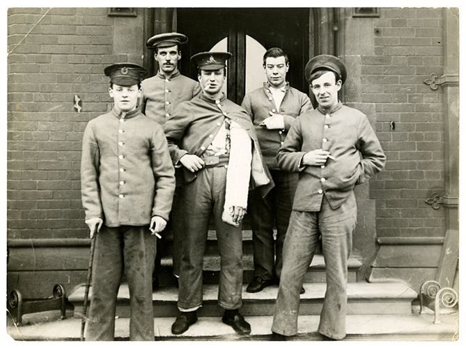 Photograph of wounded servicemen smoking outside the Armstrong Building