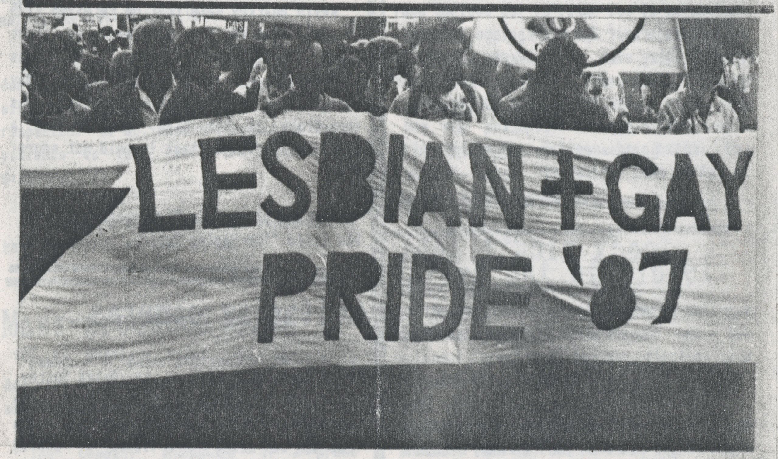 Image from the CHE Tyneside Newsletter showing a crown holding up a long white banner with 'LESBIAN + GAY PRIDE '87' on it
