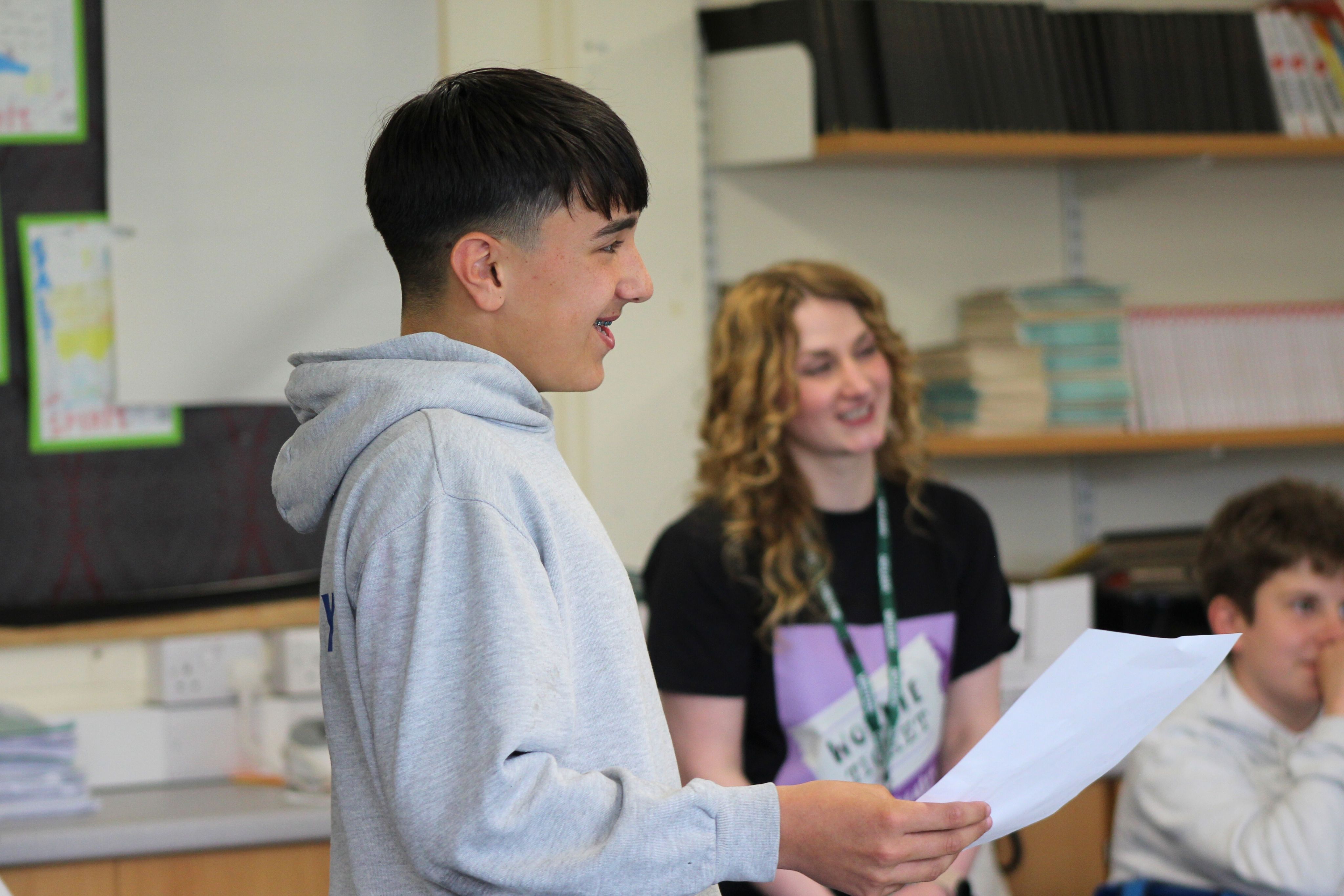 A student holding a piece of paper