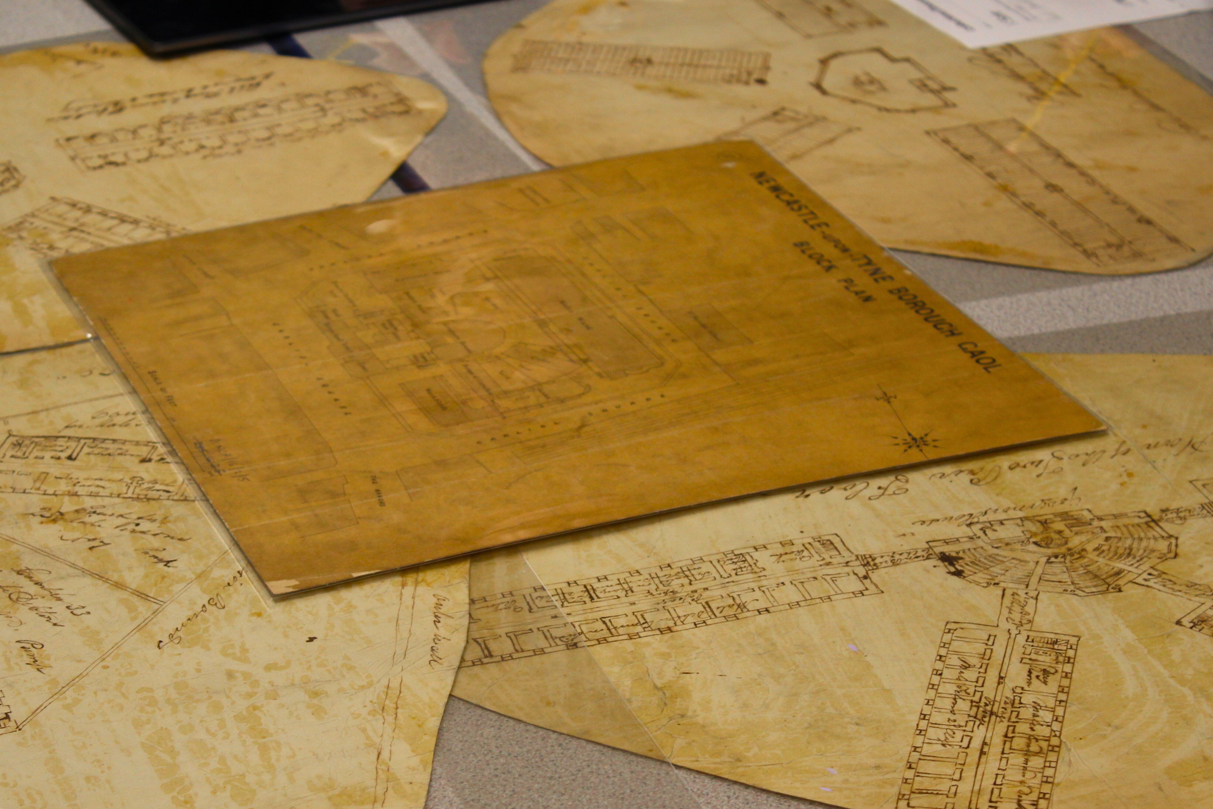 Drawings of Newcastle Gaol laid on a table