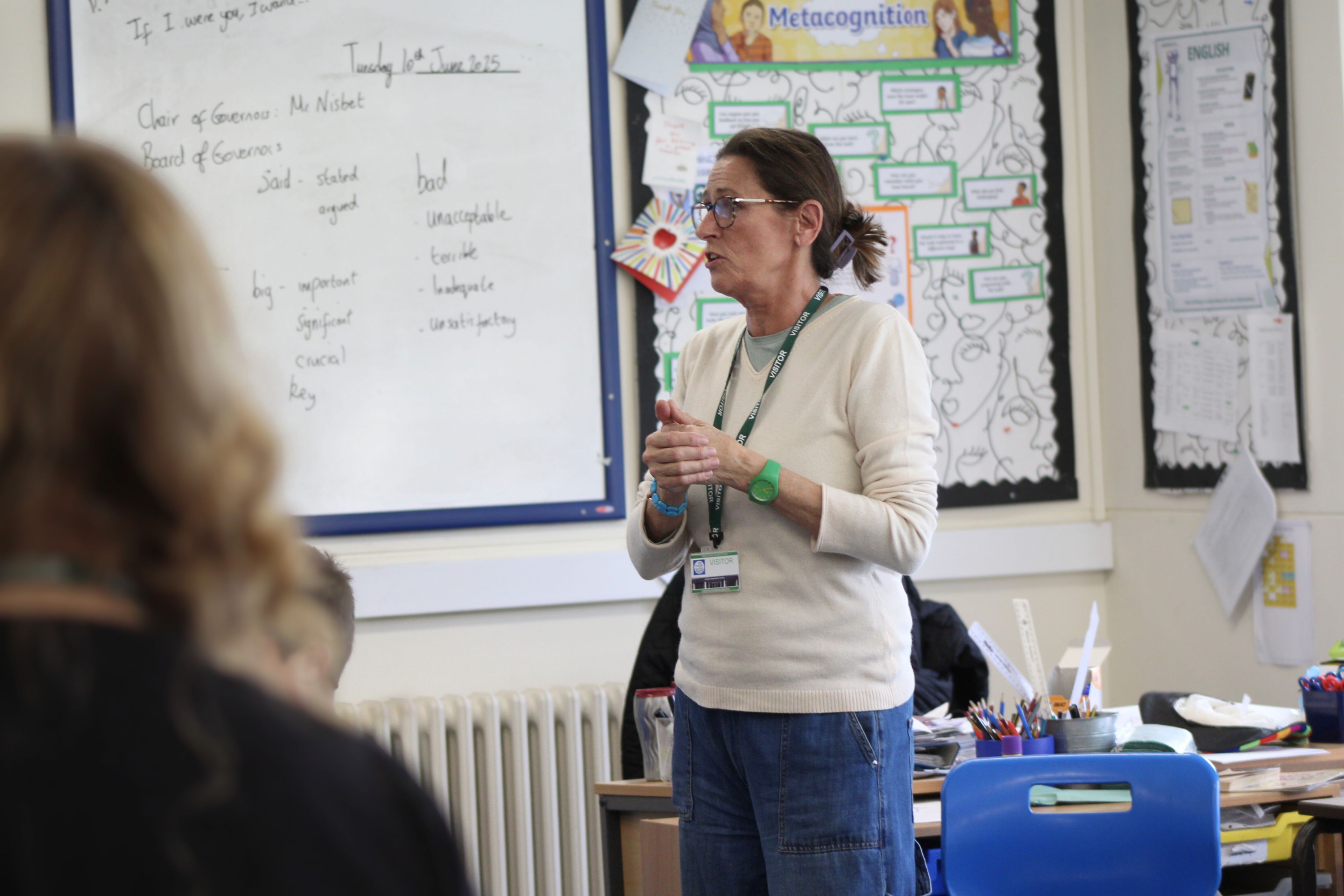 A person standing in a classroom