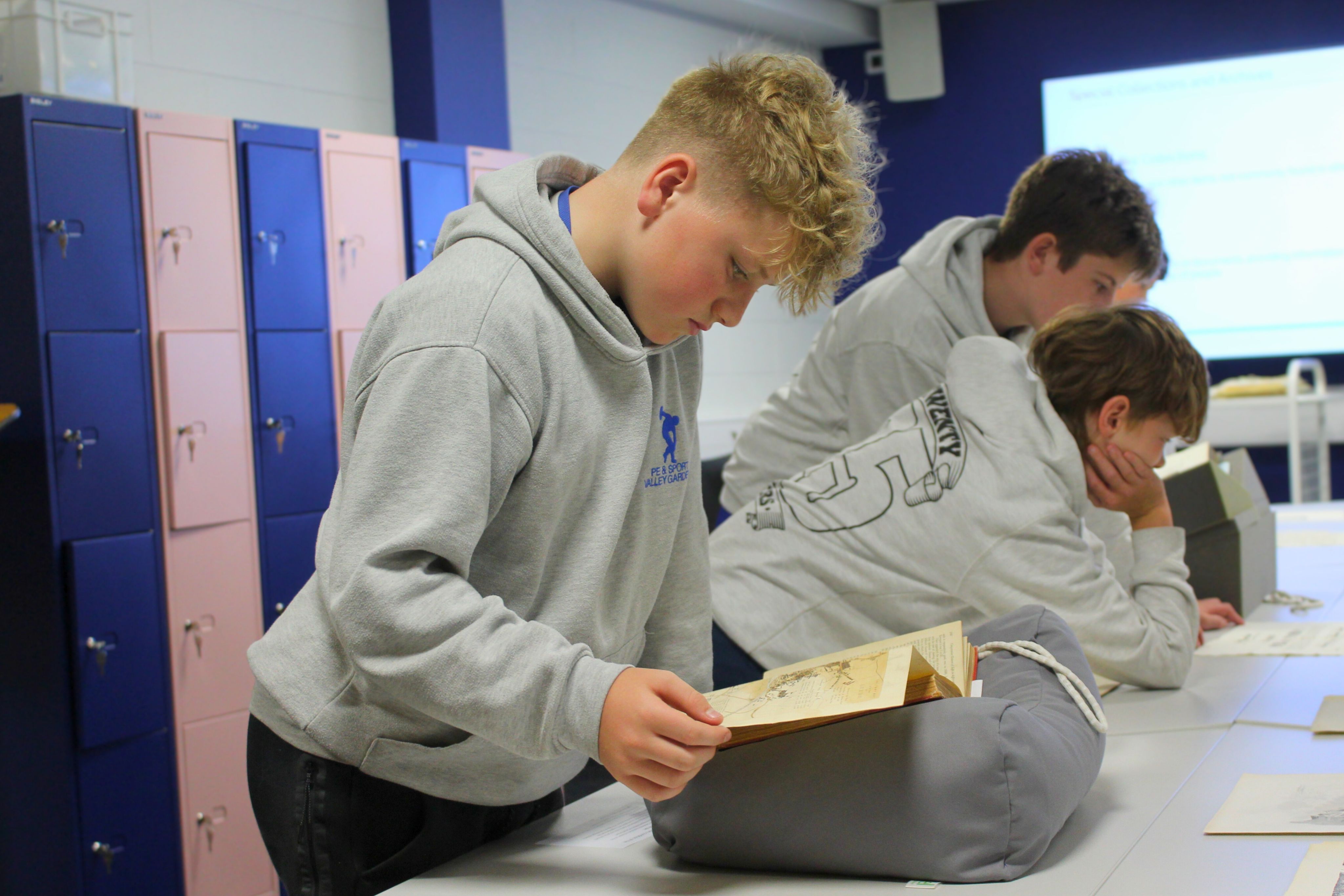 Students handling archival items