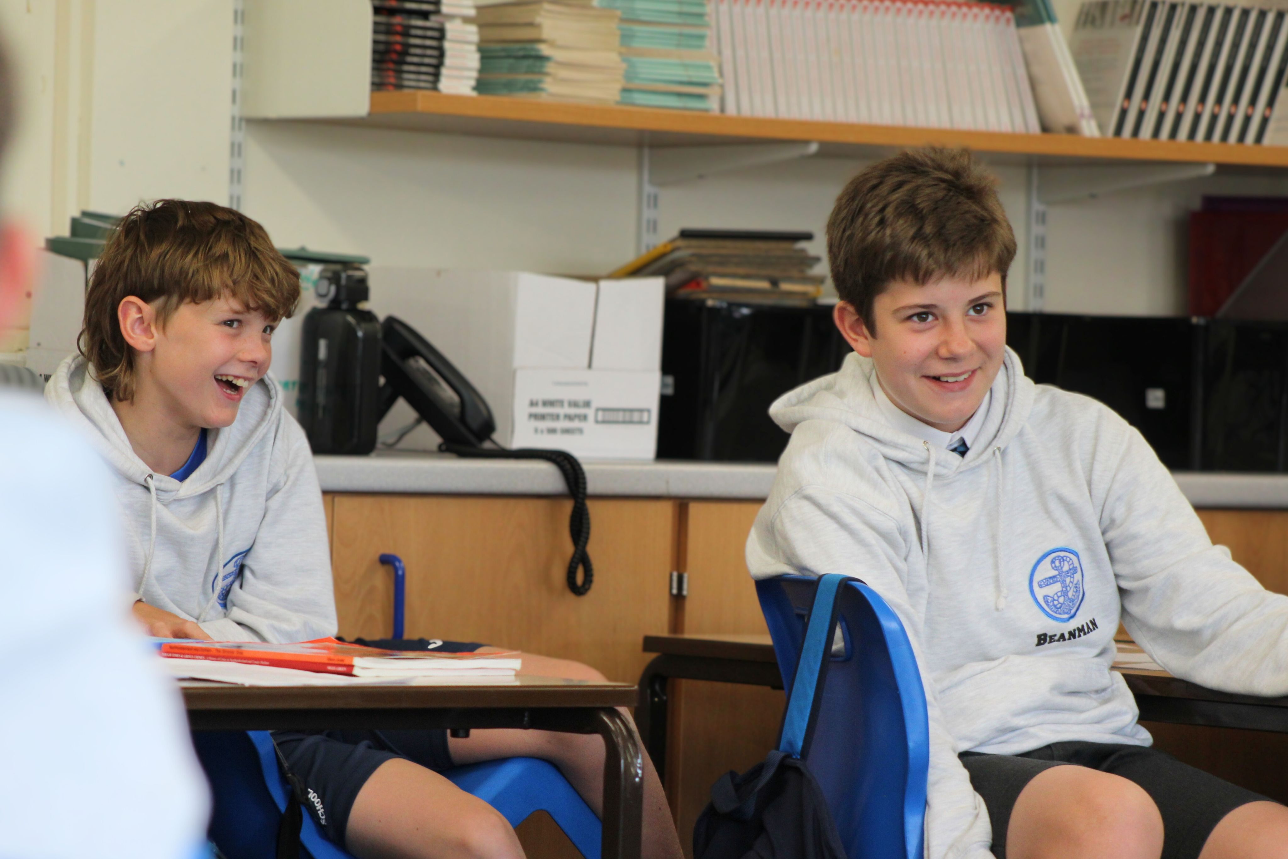 Two students smiling