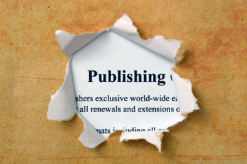 A page is torn to reveal text which says 'Publishing'