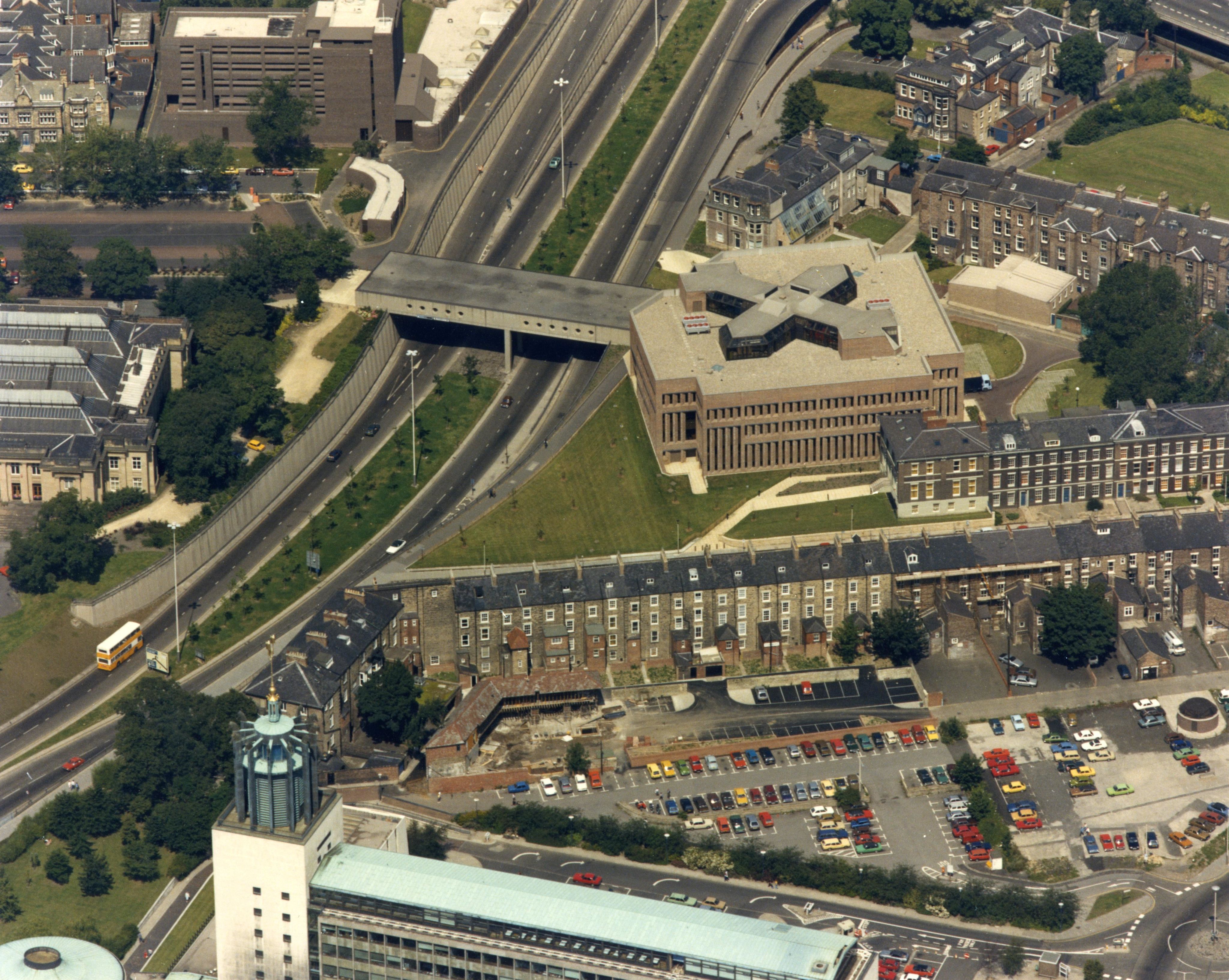 Aerial view of the Library showing central motorway and surrounding terraced houses.
