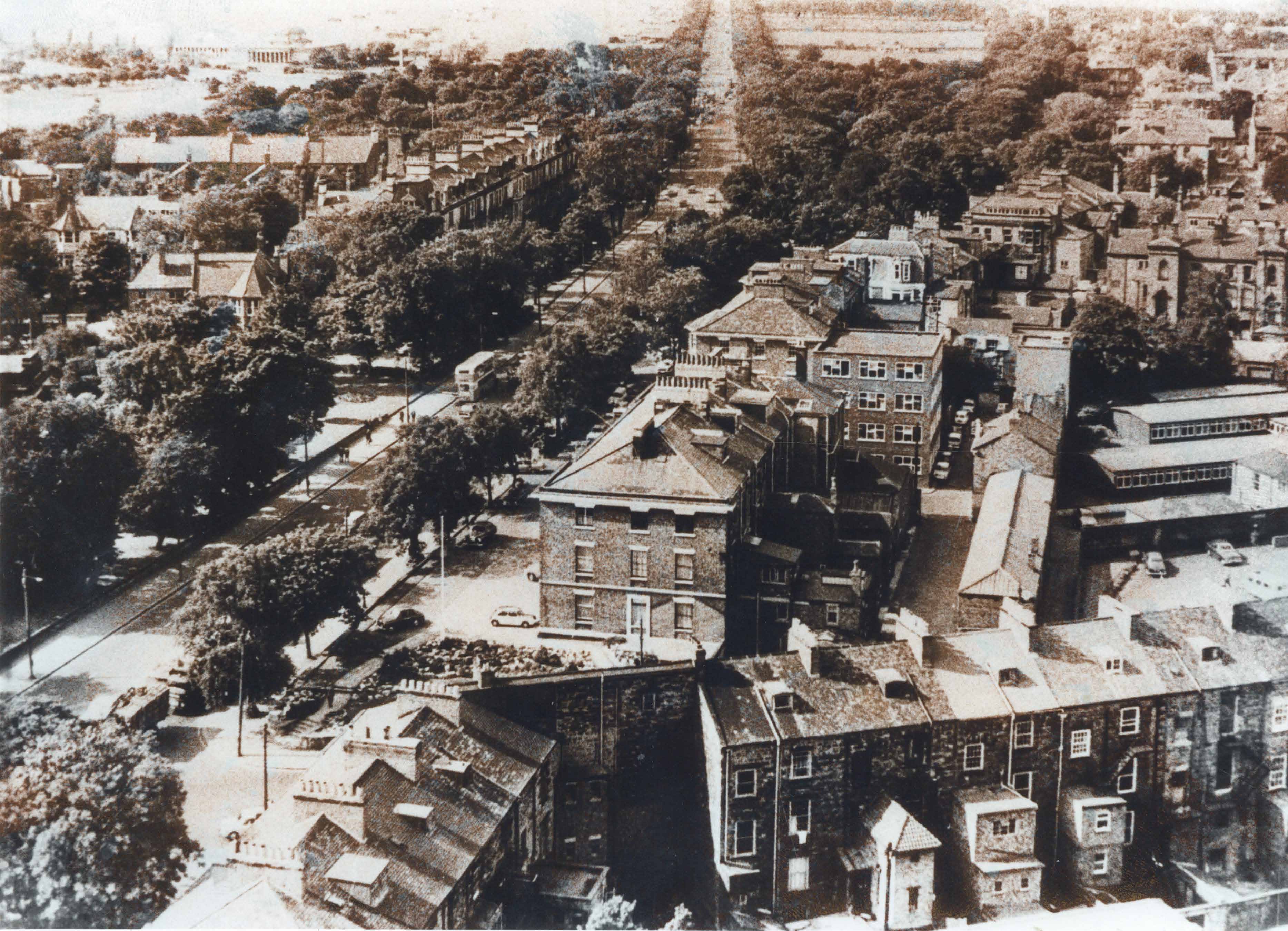 Site of the future Philip Robinson Library showing original Jesmond Road, pedestrians and traffic.