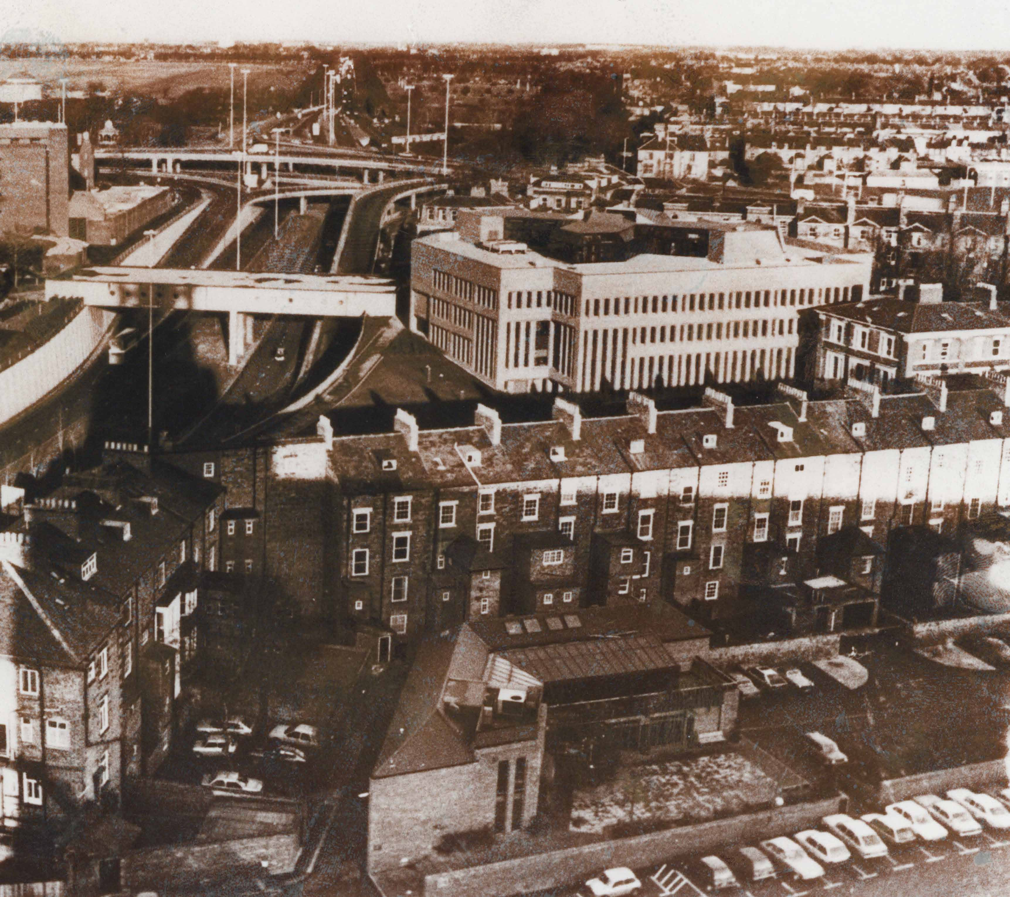 Exterior view of the Library showing motorway and surrounding houses.