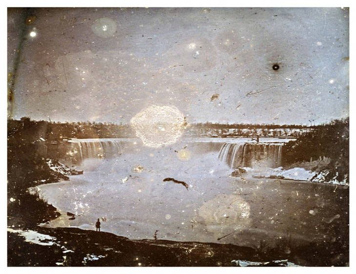 Early photograph of Niagara Falls, with some deterioration.