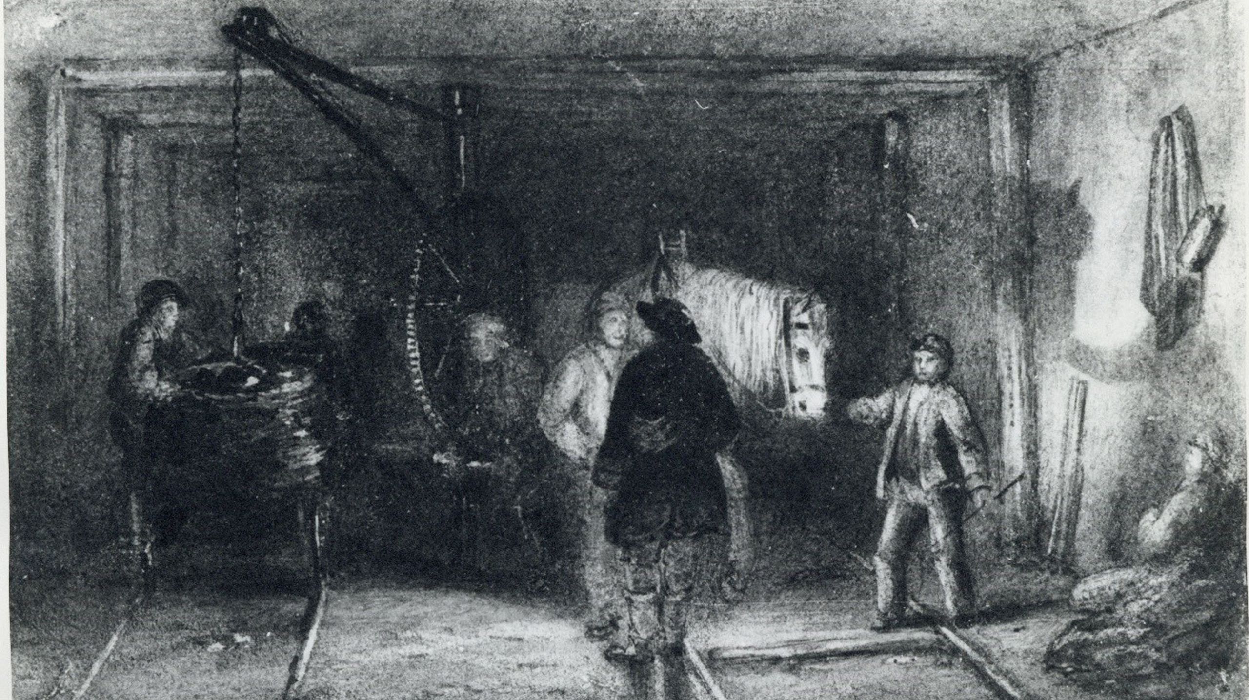 Etched print of a landscape view of a crane being used to load rollies within a mine
