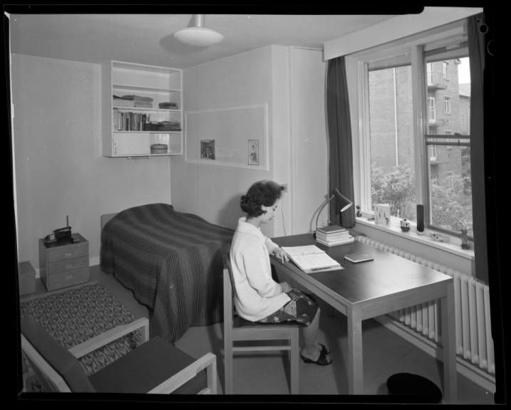 Photograph of a student sitting at her desk in Ethel Williams Hall student accommodation, 1966. NUA/K/043915/06