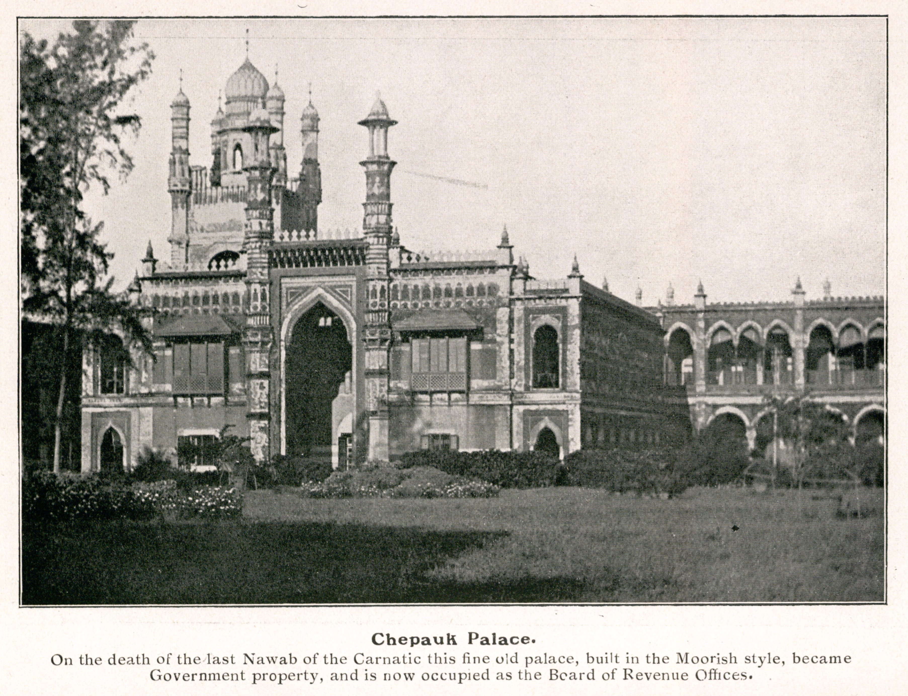 Black and white photograph of an ornate building with spires and arches