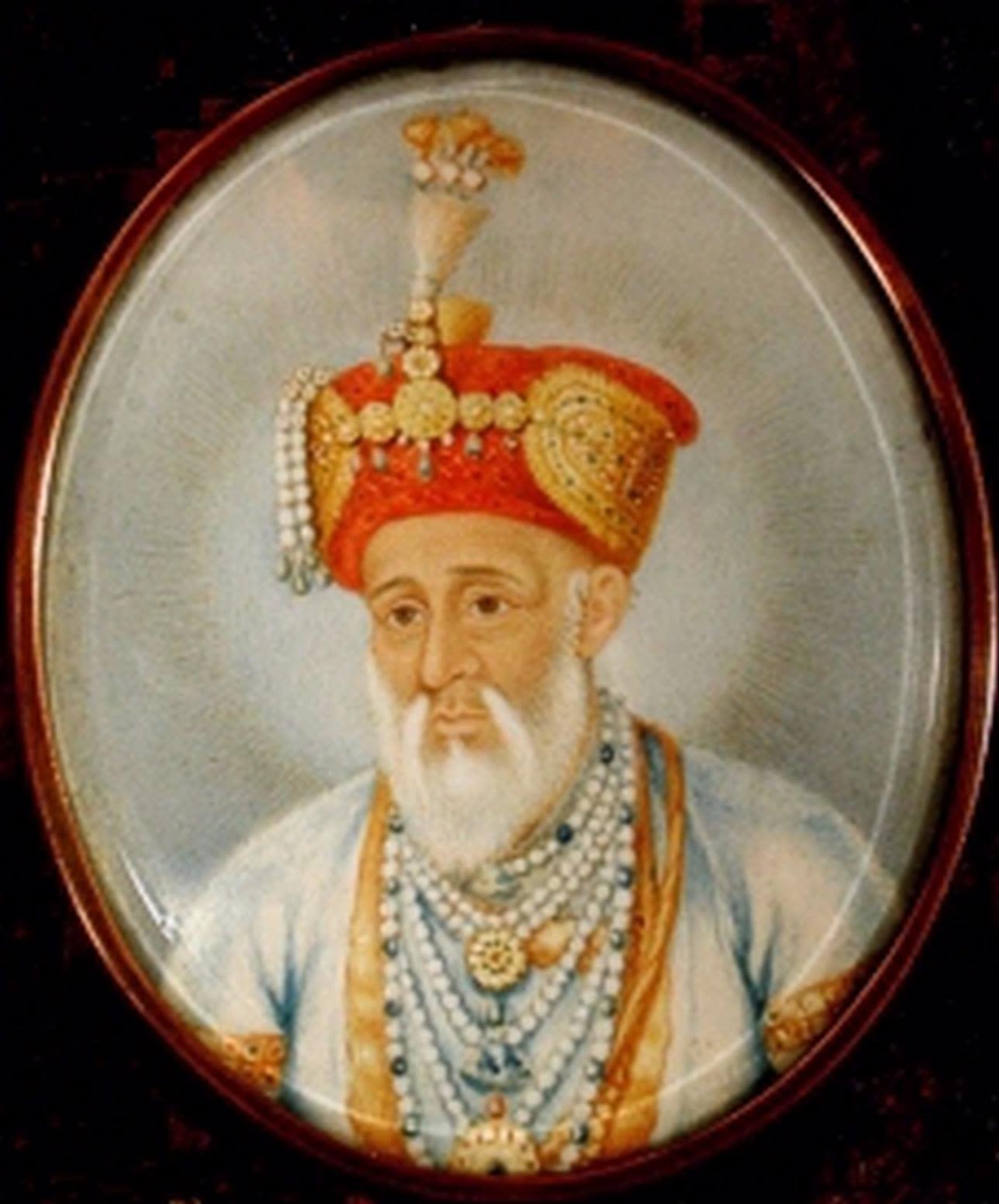 Portrait of Azim Jah as an older man with white moustache and beard, wearing an ornate turban and beaded necklaces
