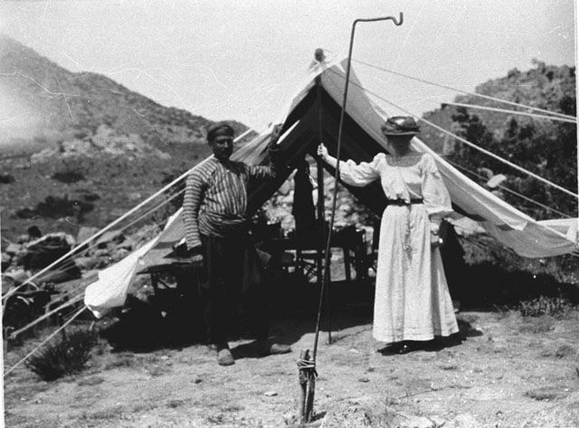 Photograph of Bell and Fattuh outside a tent.