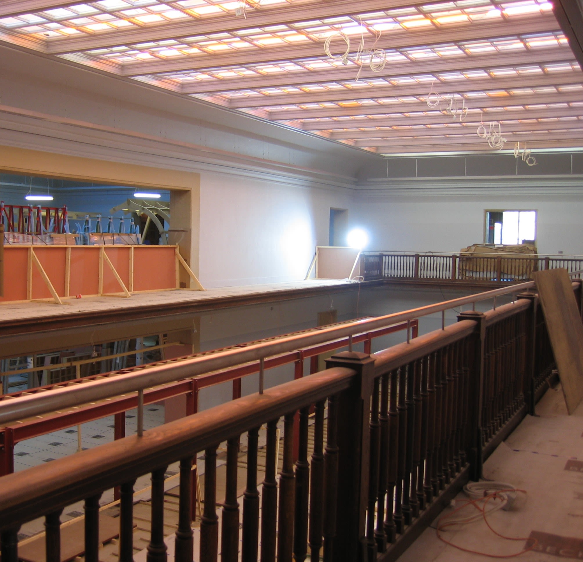A view of construction site from first floor railing.